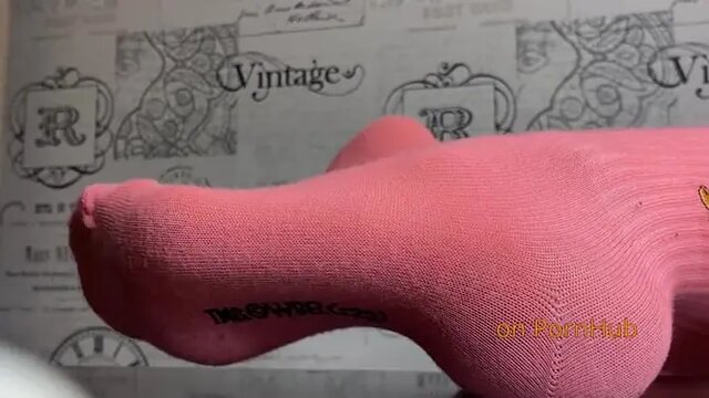 Sexy MILF gives footjob to eager cock on her legs